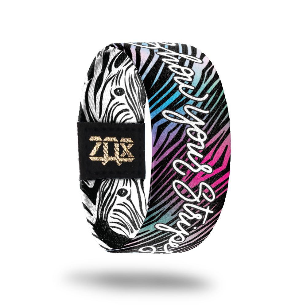 Inside desgin for Show Your Stripes. Colorful zebra pattern with blue, green, purple, and pink. Show Your Stripes centered in white text