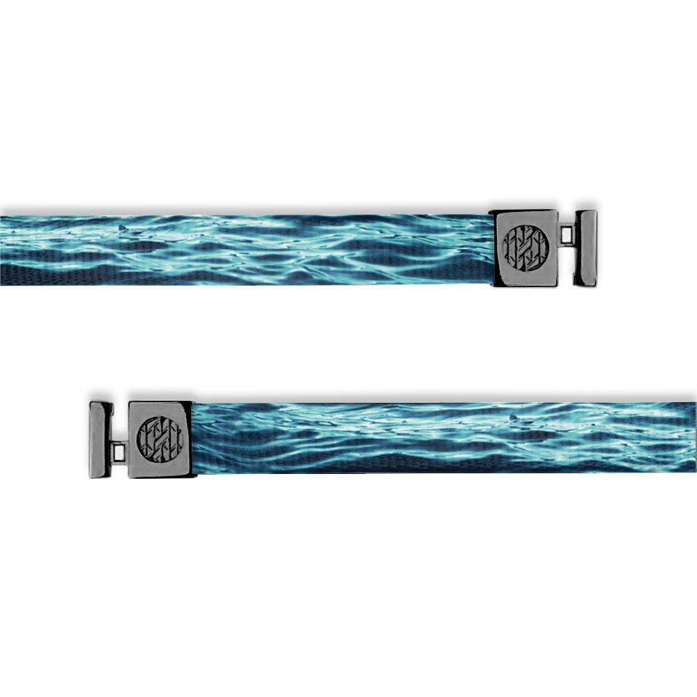 Flat hoodie string. Design is blue and teal rippling water. Inside reads "Persistence" and the aglets are black.