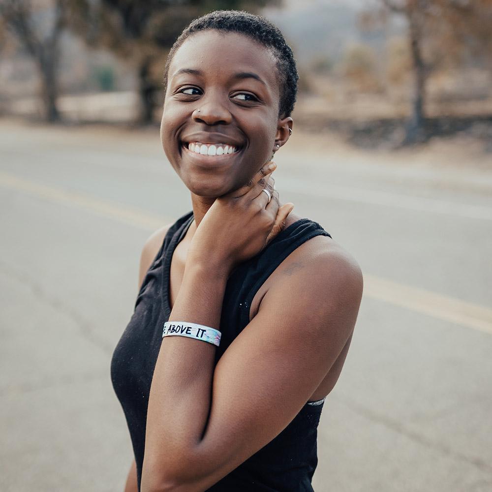 Lifestyle photo of a happy girl showing the inside design of rise above it