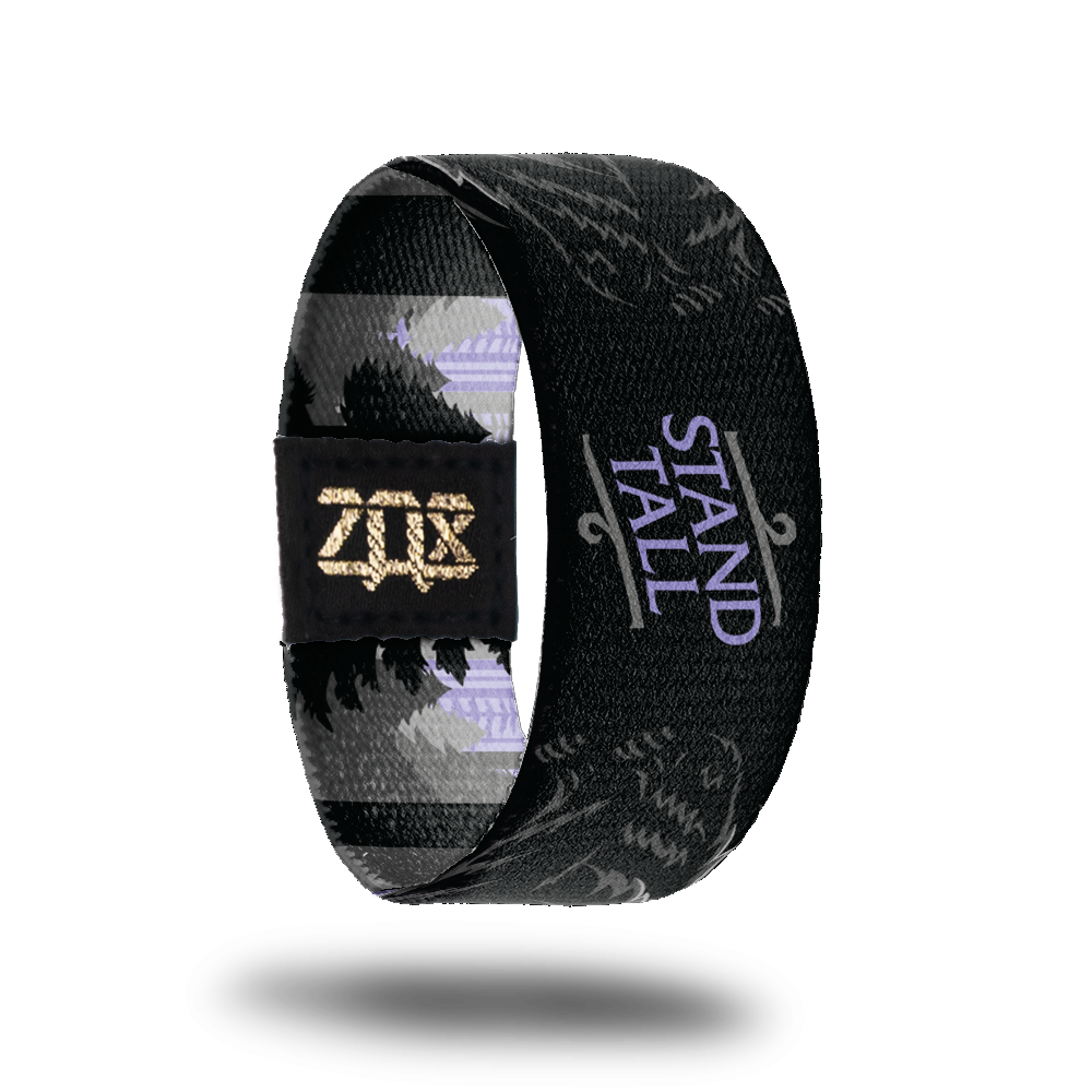 Inside Design of Stand Tall: black background with purple text in the middle 'stand tall' and two standing black bears on the sides of the text