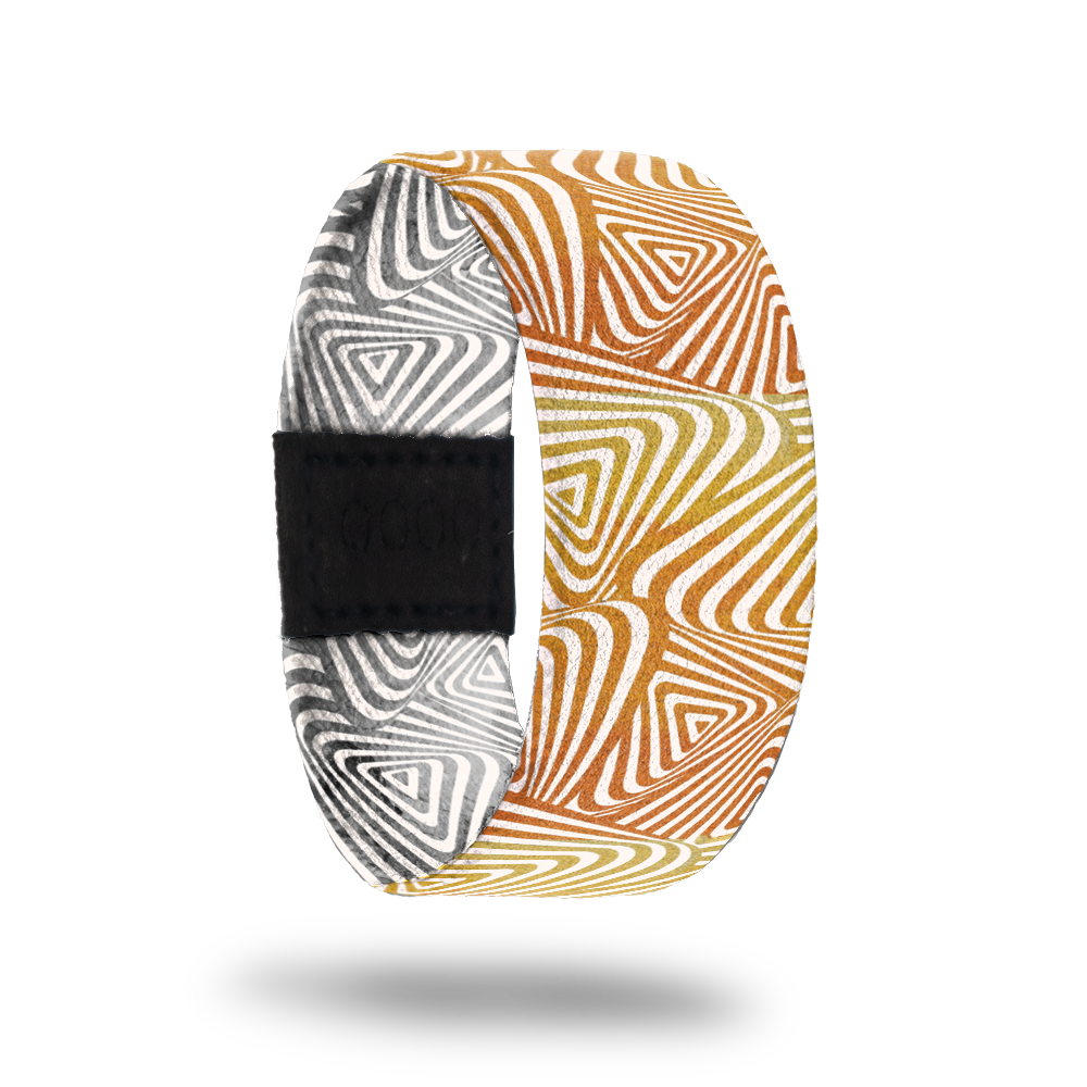 Ambition-Sold Out-ZOX - This item is sold out and will not be restocked. Orange and gold swirl shapes. Inside is the same design but in grey and white and reads Ambition. 