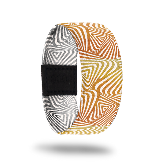 Ambition-Sold Out-ZOX - This item is sold out and will not be restocked. Orange and gold swirl shapes. Inside is the same design but in grey and white and reads Ambition. 