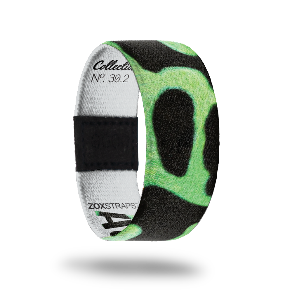 Auratus-Sold Out-ZOX - This item is sold out and will not be restocked. Solid black strap with neon green circular shapes. Inside is solid white and says Auratus. 