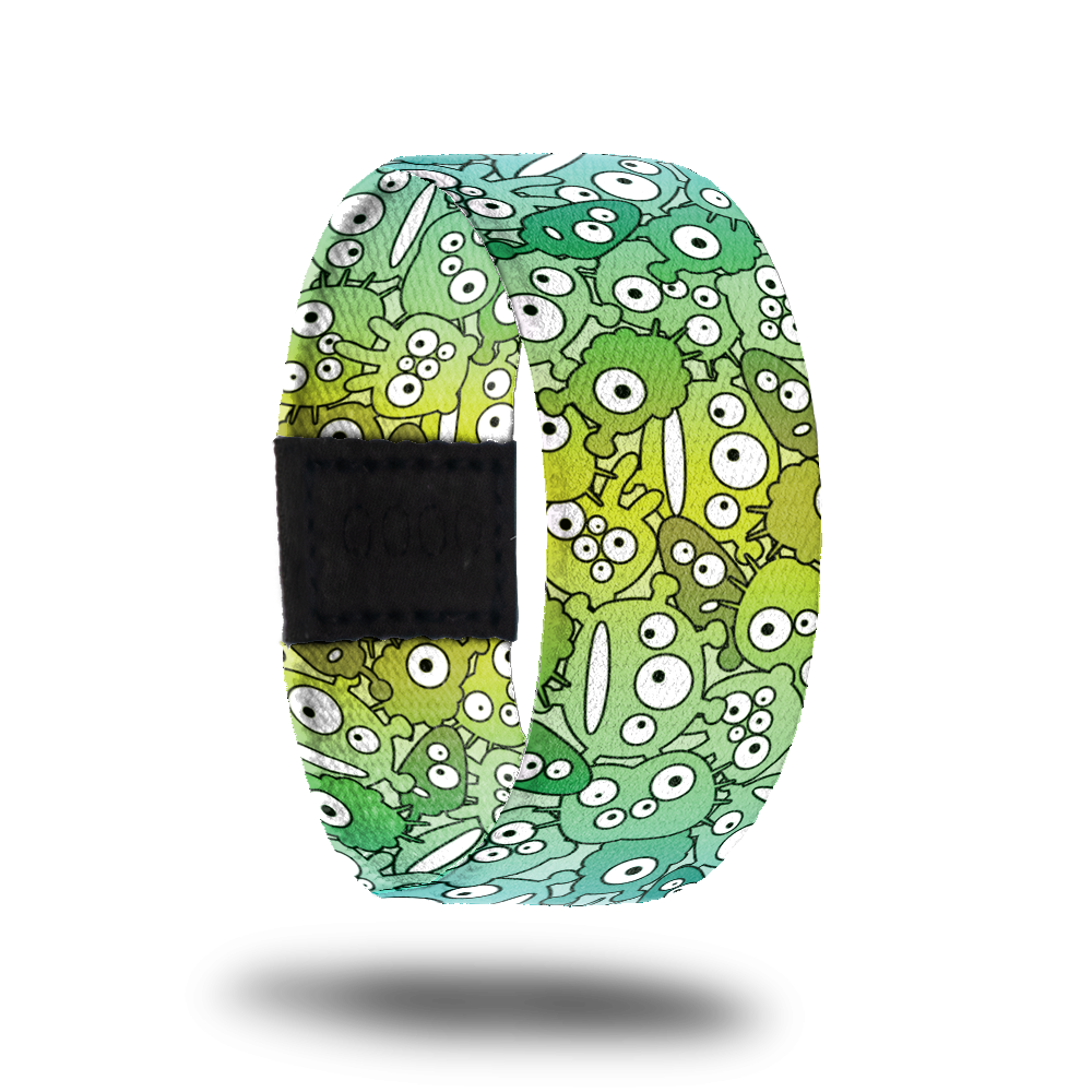 Be Weird-Sold Out-ZOX - This item is sold out and will not be restocked. Bright green strap with cute cartoon monsters all over in various shades of green. Inside is the same and says Be Weird. 