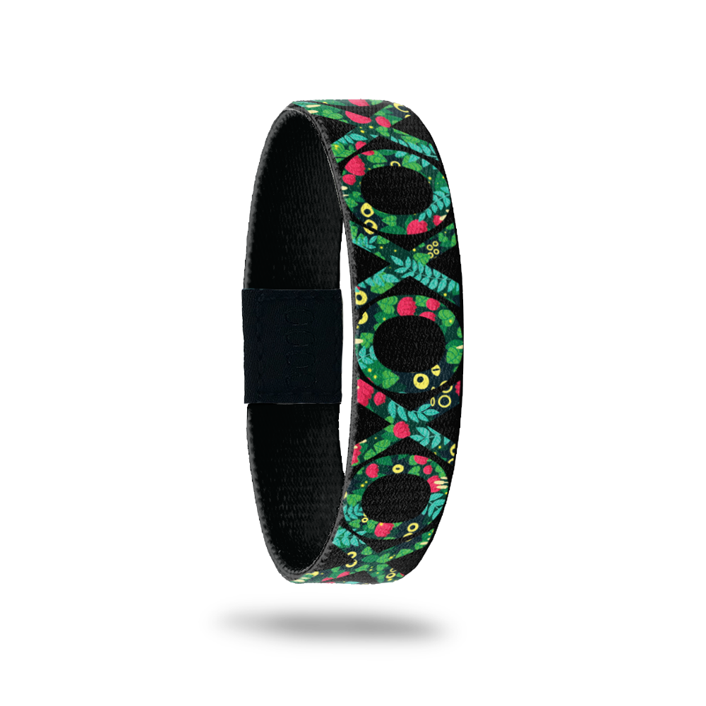 This is a reward item and not purchasable. It is a reversible single and is earned for having the blog subscription for 1 year+. The design is green, red and yellow hearts inside the letters of X and O around the entire ZOX. The inside reads F&F for Family & Friends. 