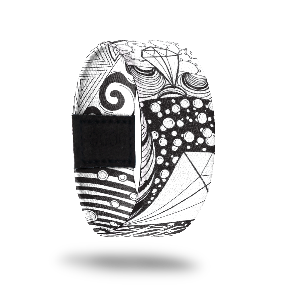 Balanced-Sold Out-ZOX - This item is sold out and will not be restocked. White strap with abstract black line drawing all over. Inside is the same and says Balanced. 