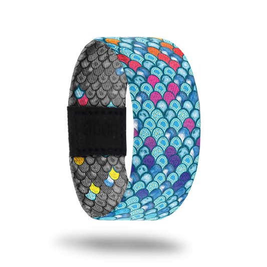 Be Kind-Sold Out-ZOX - This item is sold out and will not be restocked. Bright blue scales of a mermaid with random pink and orange ones. Inside is all gray scales with random colored ones and says Be Kind. 