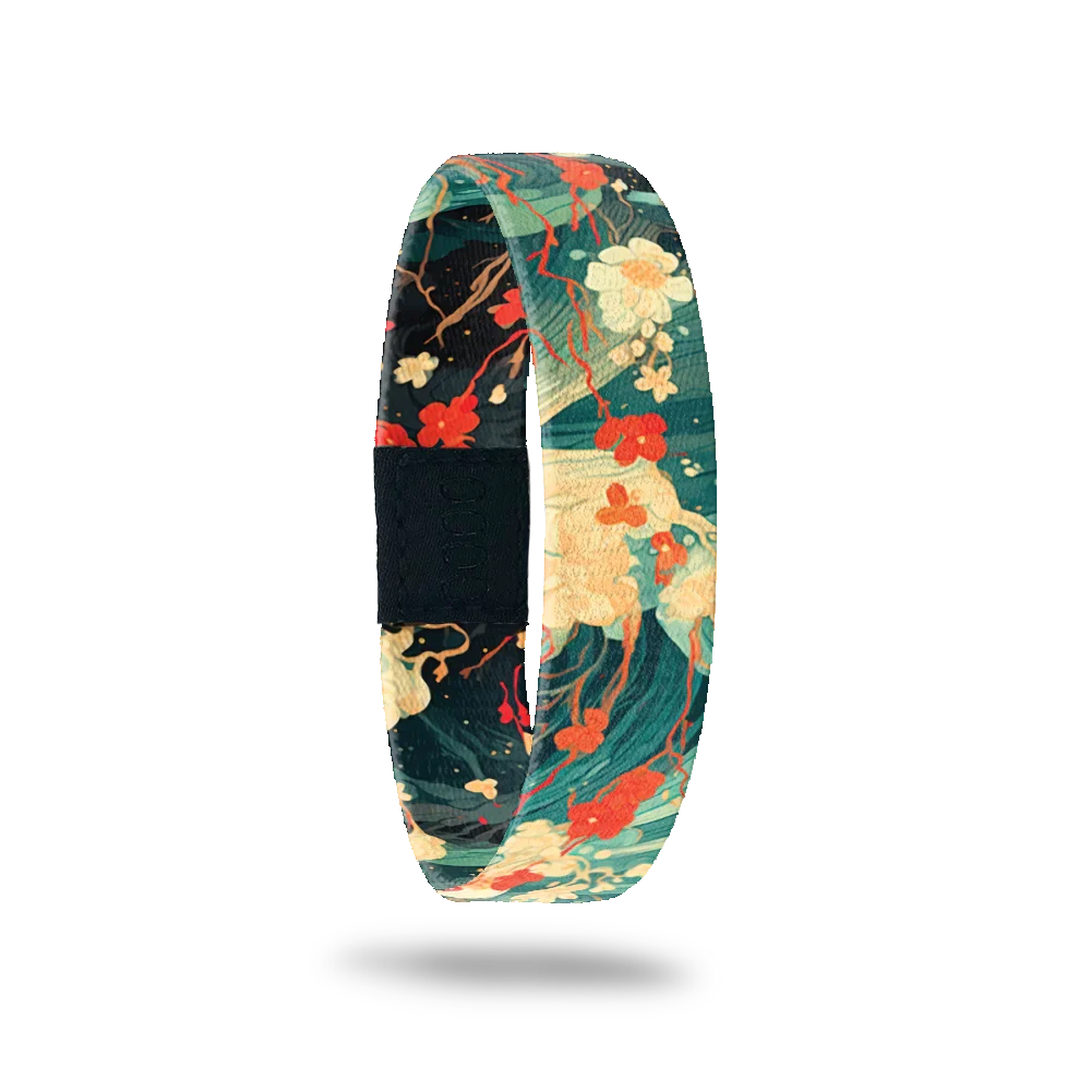 Dark teal and green waves crashing with red and white flowers on top. Inside is the same and reads Before You Know It. 