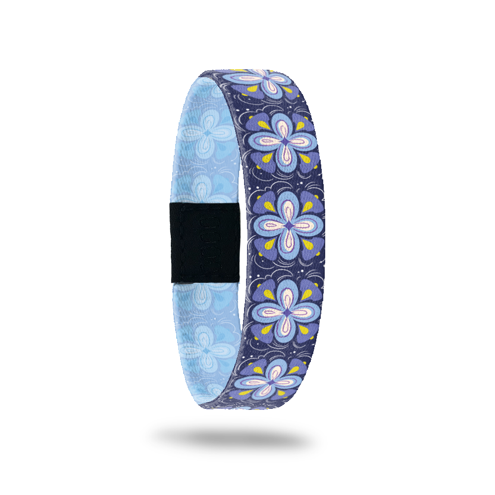 Dark blue single with purple and blue flowers all over and yellow specs. Inside is pale blue and says Believe In You Like I Do. 