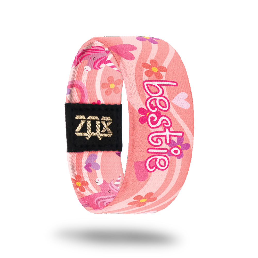 Inside design for Bestie, A pink background with a lighter pink wave that goes across the design. Flowers and hearts in shades of pink and Bestie in white and pink text at the center