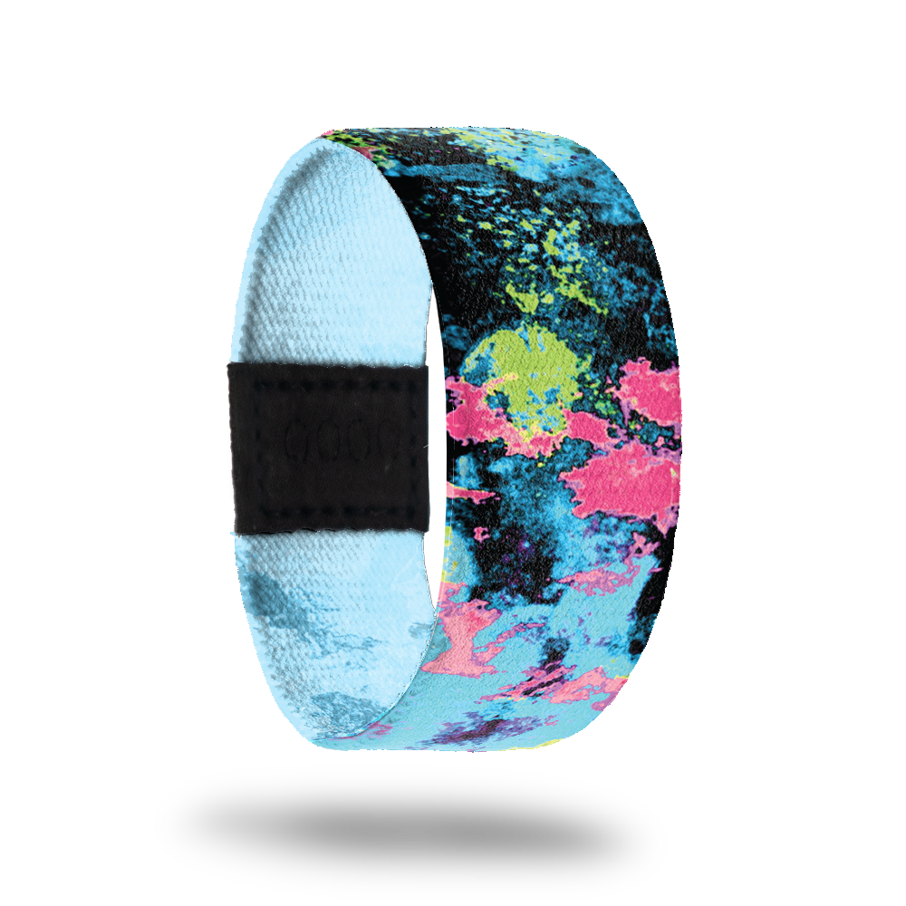 Blacklight-Sold Out-ZOX - This item is sold out and will not be restocked. A blacklight image with each shadow highlighted in different colors- black, teal, neon green and pink. Inside is solid blue and reads Blacklight. 