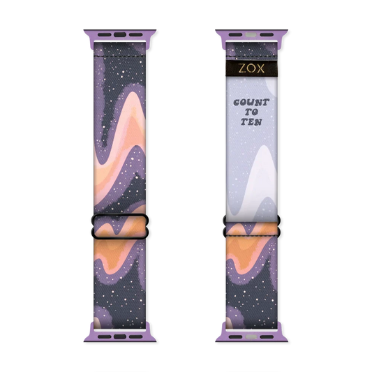 This is a watchband and not reversible. The design is orange, purple and gray swirls with white speckles everywhere. The inside is the same and reads Count To Ten. 