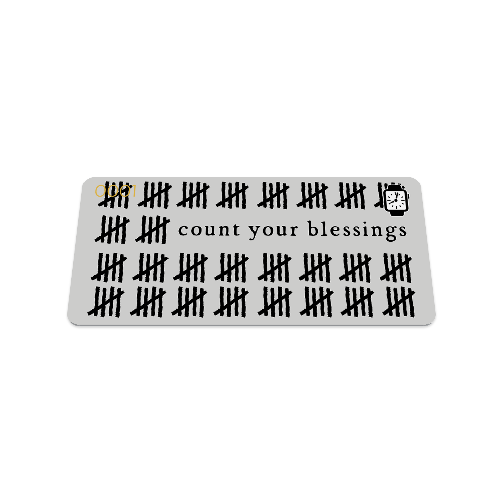 This is the front of the collector's card. It is a light grey design with black hash marks all over and says "count your blessings" in black text.