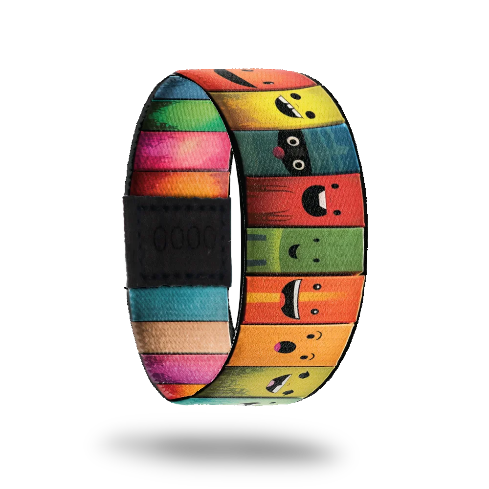 ZOX strap with colorful books along the entire design. Each book has a cute smiley face and the inside reads Don't Judge a Book By It's Cover. 