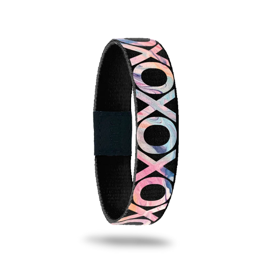 Wristband single with black base. Covered in X's and O's all with pastel gradient design inside. 