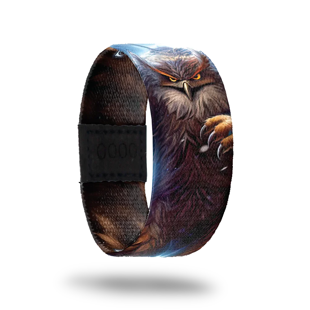 ZOX strap with realistic design of an owl with glowing eyes and talons. Inside reads Face Your Foe. 