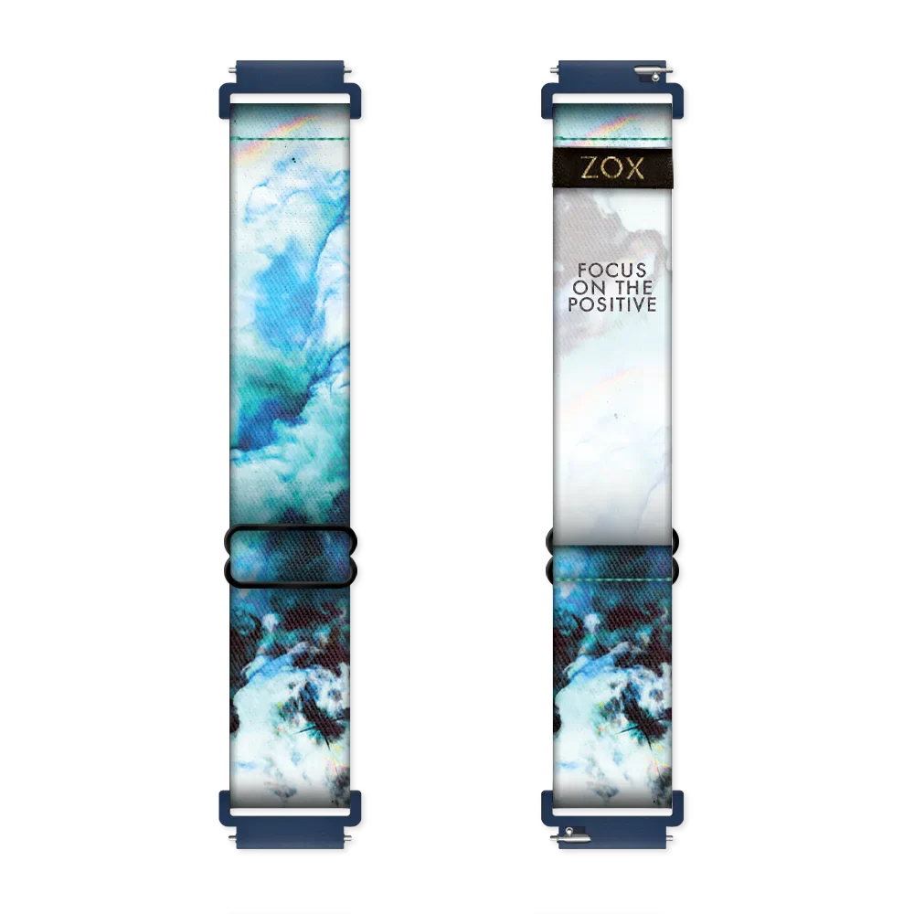 Watchband with a blue, teal, black and white marble design. Inside reads Focus On The Positive. Check size guide for compatible watches.