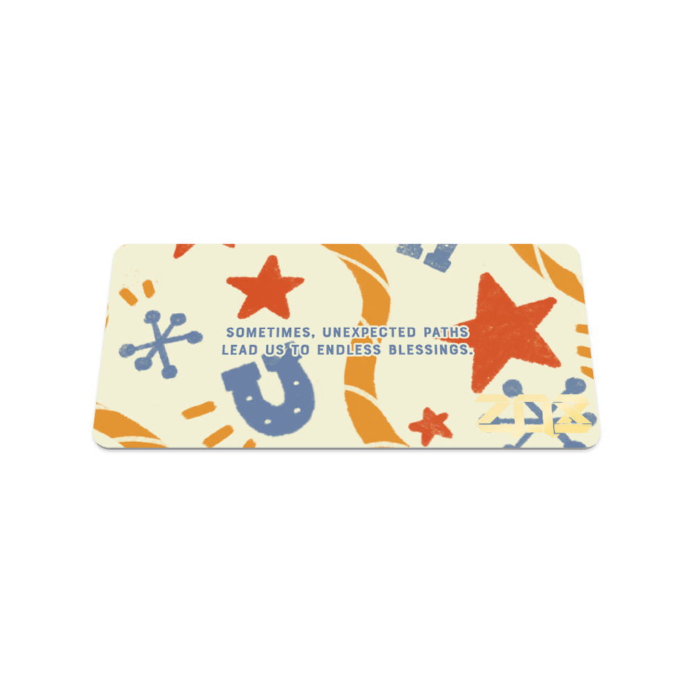Back collector's card image of Here For a Reason: light creme/yellow design with larger orange and blue cacti, cowboy boots, ropes, cowboy hats, and longhorns with blue text 'Sometimes, unexpected paths lead us to endless blessings.'