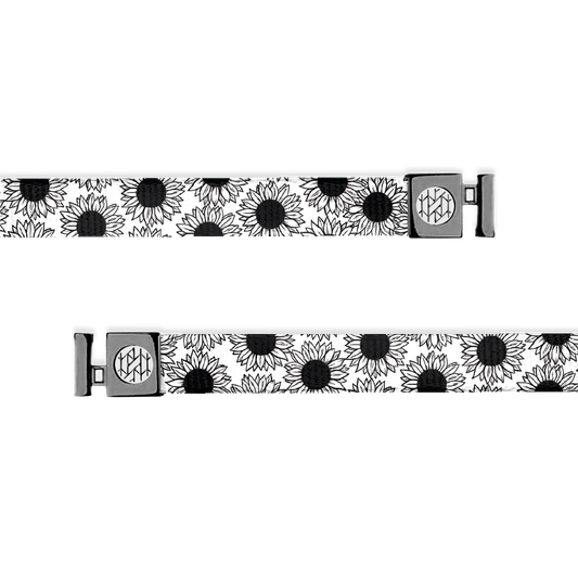 Outside is white with black daisies all over and grey aglets. 