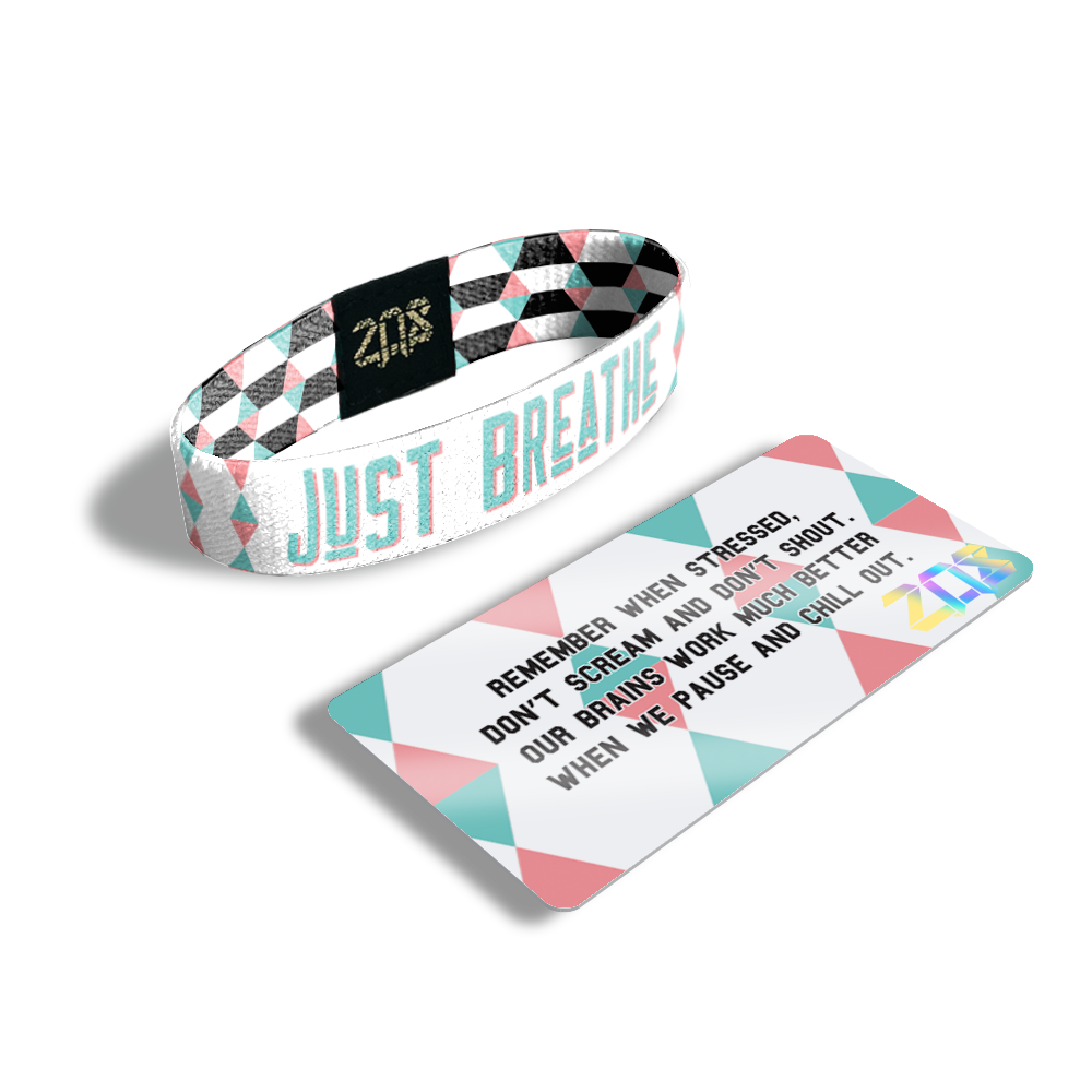 Inside Design of Just Breathe: geometric white and pink design with blue with pink outline text ‘Just Breathe‘ and its card which says 'Remember when stressed, don't scream and don't shout. Our brains work much better when we pause and chill out.'