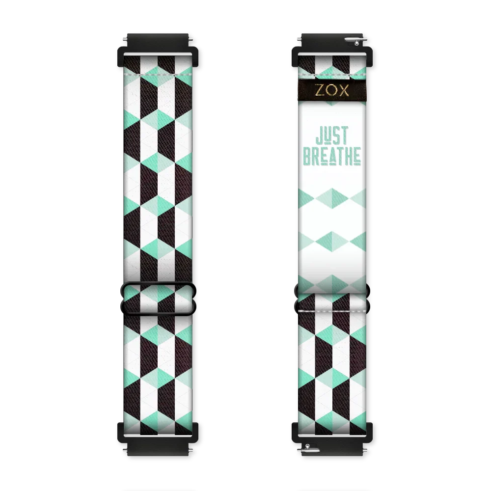 Black, white and mint colored parallelograms all over the design. Inside is the same and says Just Breathe. Check size guide for compatible watches.
