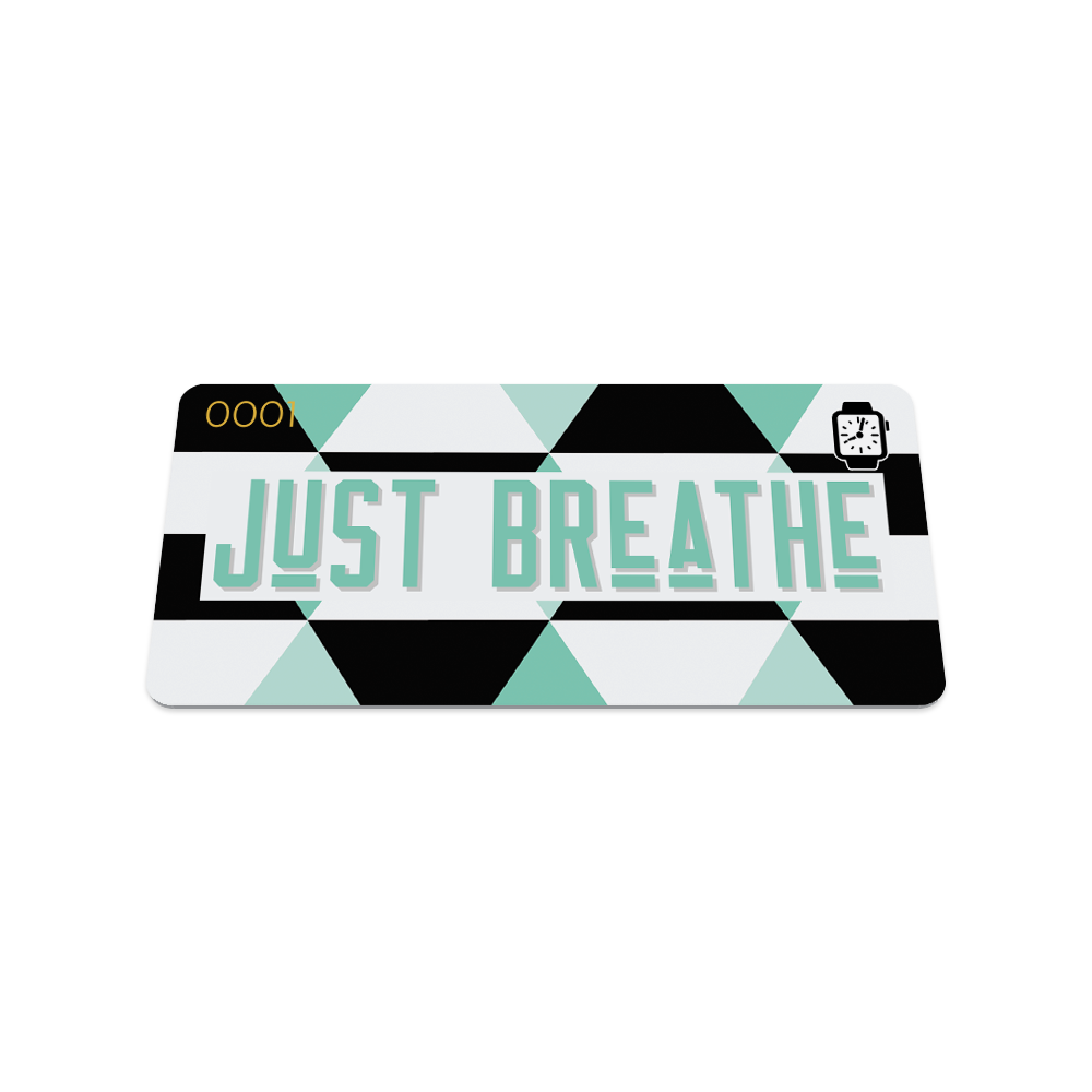 This is the front of the collector's card. The design is black, white and teal parallelograms around the edges. In the center is a white box and the text is teal and reads "just breathe".