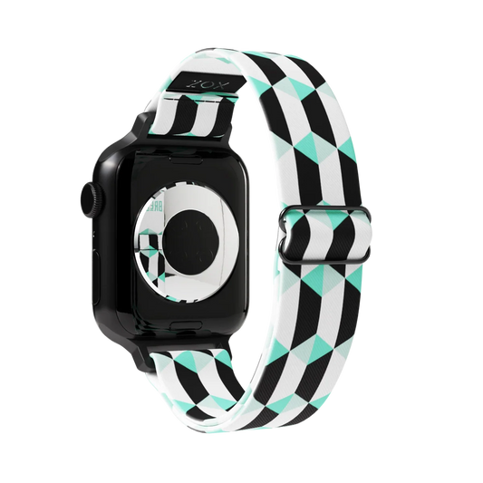 Black, white and mint colored parallelograms all over the design. Inside is the same and says Just Breathe. Check size guide for compatible watches.
