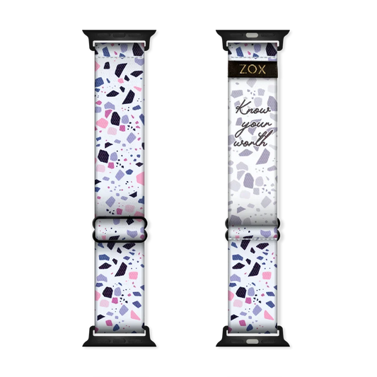 Watchband with a white base. The design is purple, pink, black and grey speckles all over. The inside is the same and reads Know Your Worth. Check the size guide for compatible watches. 