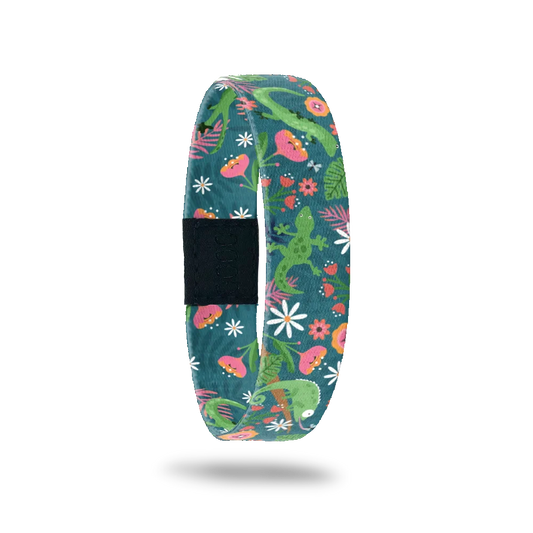 Wristband single is a dark green base. The design is bright green lizards in a mix of pink nd oranges flowers and vines.  The inside is the same and reads Leaping Lizards. 