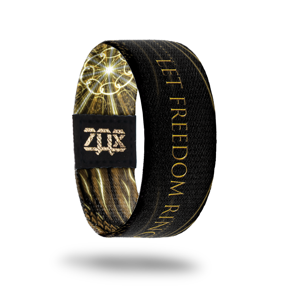 Inside design of Let Freedom Ring. Black background with Let Freedom Ring in gold color text