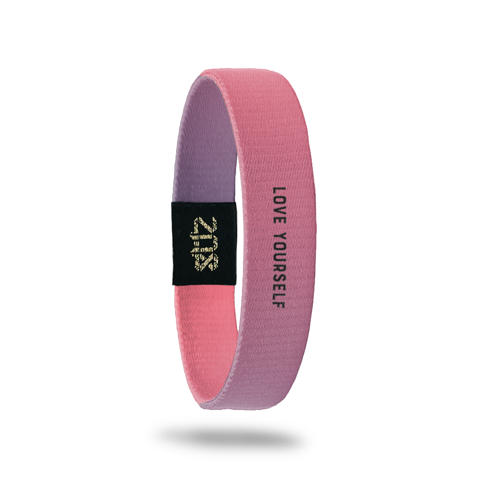 Product photo of inside design with a small bold black text love yourself overlaying a purple to pink gradient