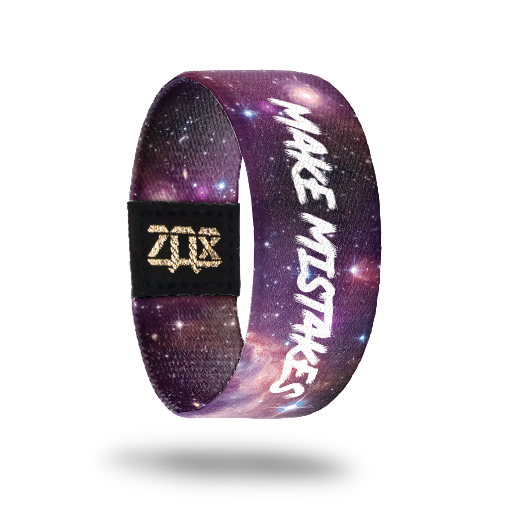 Inside design of Make Mistakes. Shades of purple for the open space design with a few stars spread out. Make Mistakes in white text in the middle