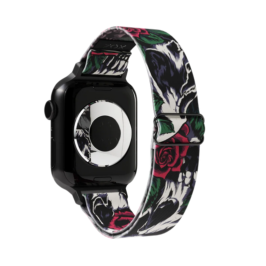 Watchband has a black base and is grunge looking. It has a design of white and grey skulls up close with roses and leaves. The inside is the same and reads Memento Mori. Check out size guide for compatible watches.