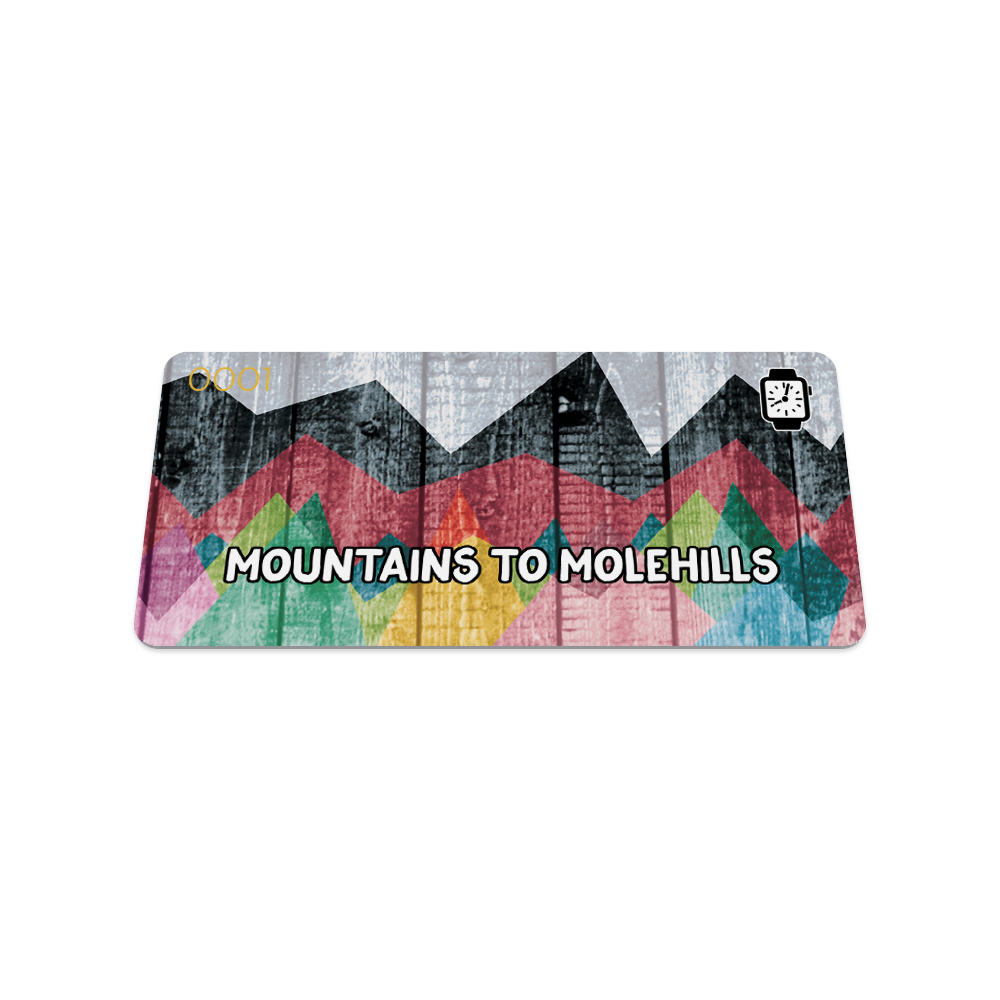 Front of the collector's card which has a gray picket fence in the background with colorful abstract mountains on top. It reads Mountain to Molehills in white text.