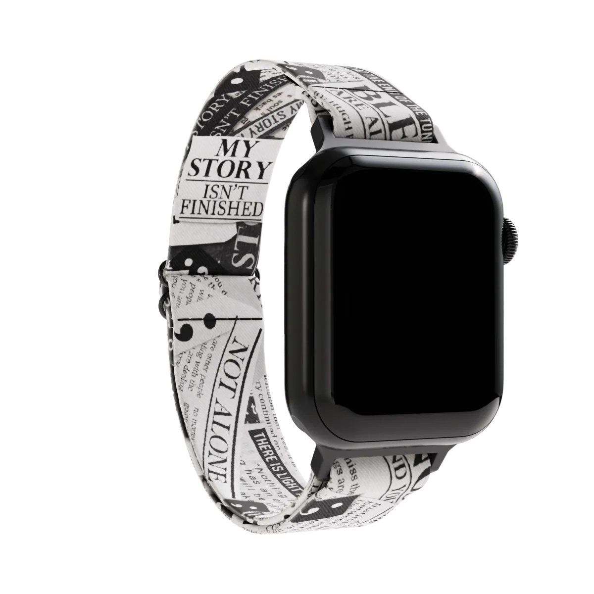 Watchband with a black and white newspaper clipping design. The text is upclose and has random "headlines" of motivational words such as "not alone". The inside is the same and reads My Story Isn't Finished. Check out the size guide for compatible watches.
