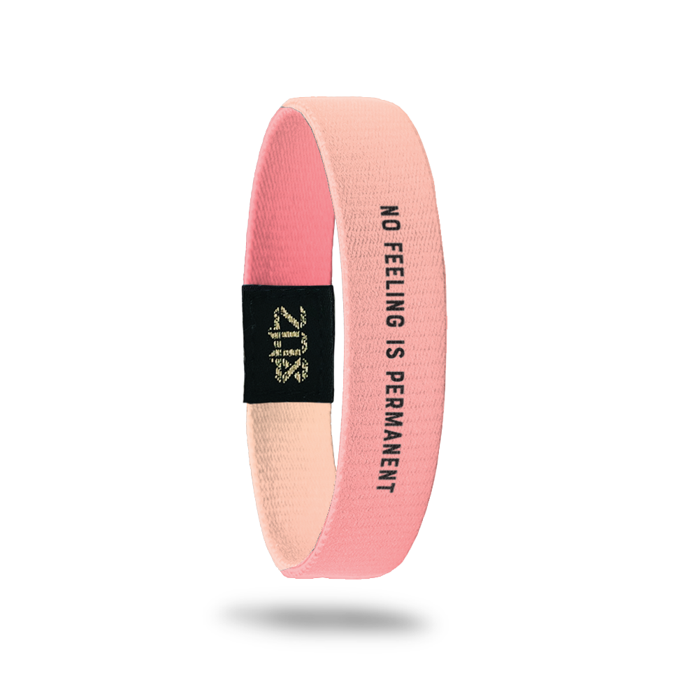 Product photo of inside design with small bold black text no feeling is permanent overlaying a pink to peach gradient