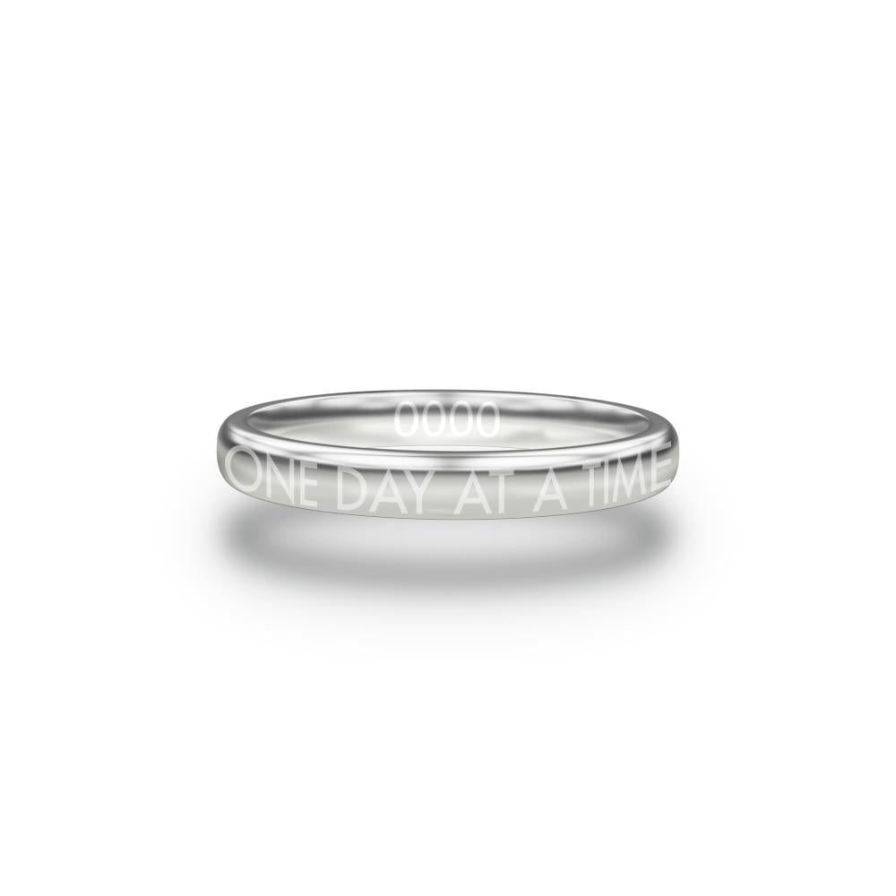 Front design of One Day At A Time silver ring with sketched in text ‘One Day At A Time’