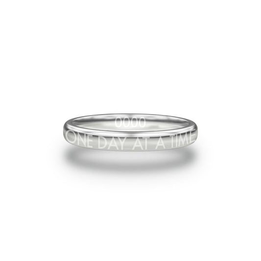 Front design of One Day At A Time silver ring with sketched in text ‘One Day At A Time’