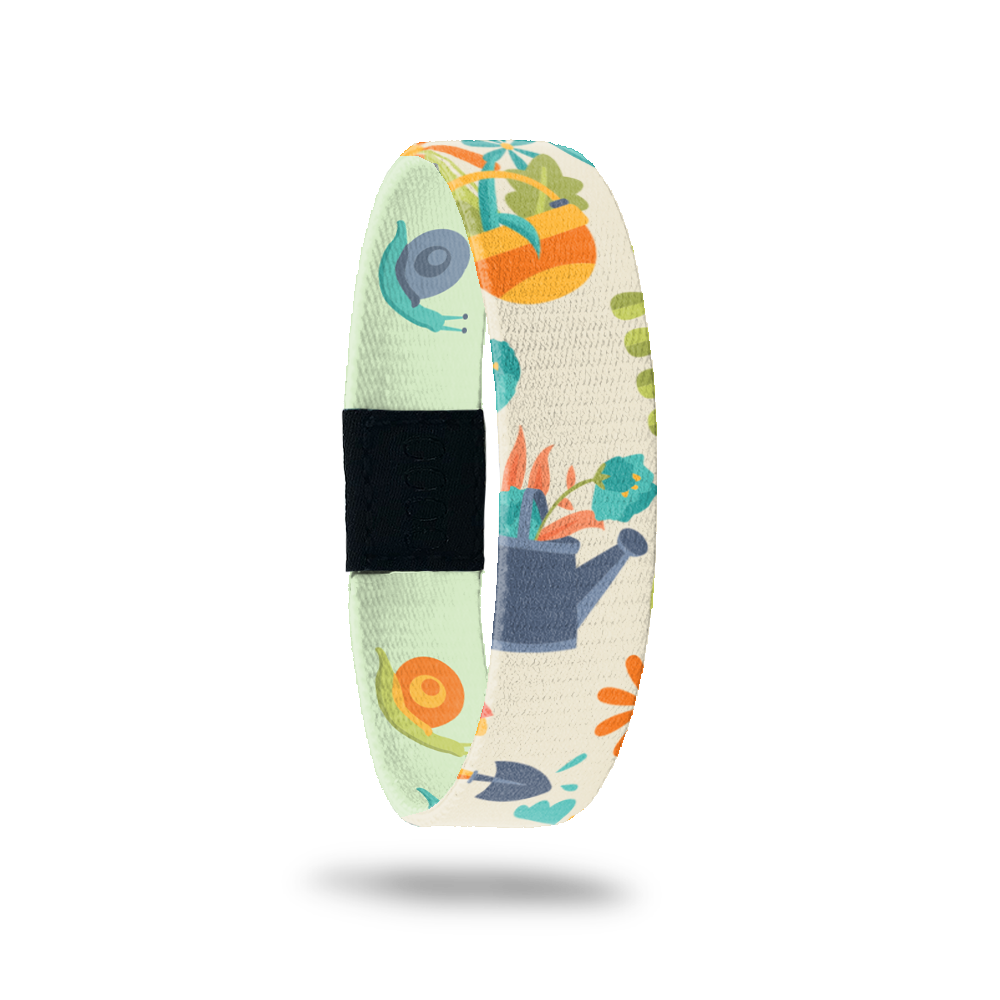 Outside Design of Positive Thoughts: tan background with drawn flower pots, plants, shovels, snails, and watering cans
