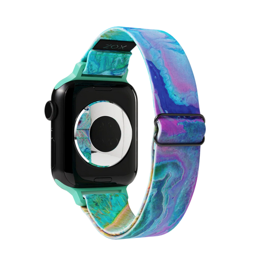 Outside is a geode design in purple, blue and green.