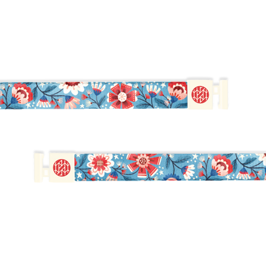 Hoodie string with a light blue background. On top are red, white and blue flowers of various shapes and kinds. 