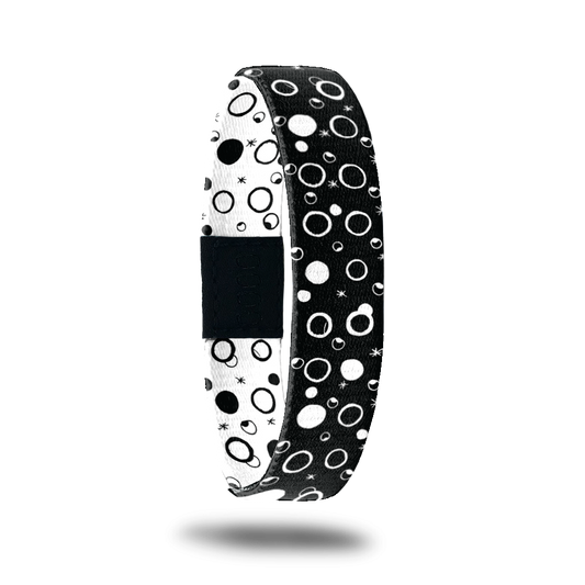 Outside design for Take A Chance. Black background with white filled and outlined circles 
