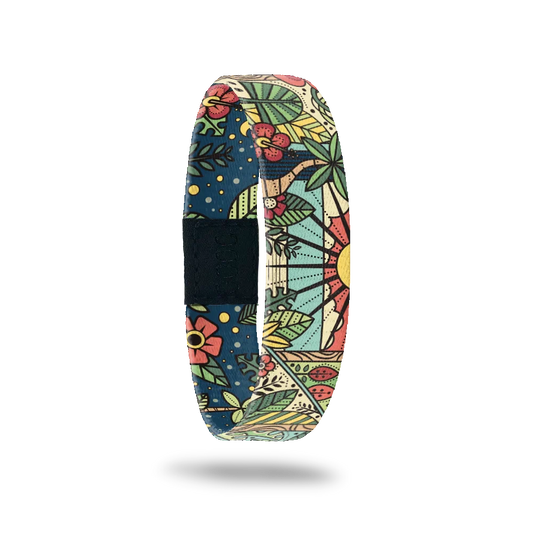 Wristband design of looking at the sun outside a window with flowers and plants all around. The insiide is navy blue with flowers and reads Soak Up The Sun. Comes with a matching lapel pin and collector's box. 