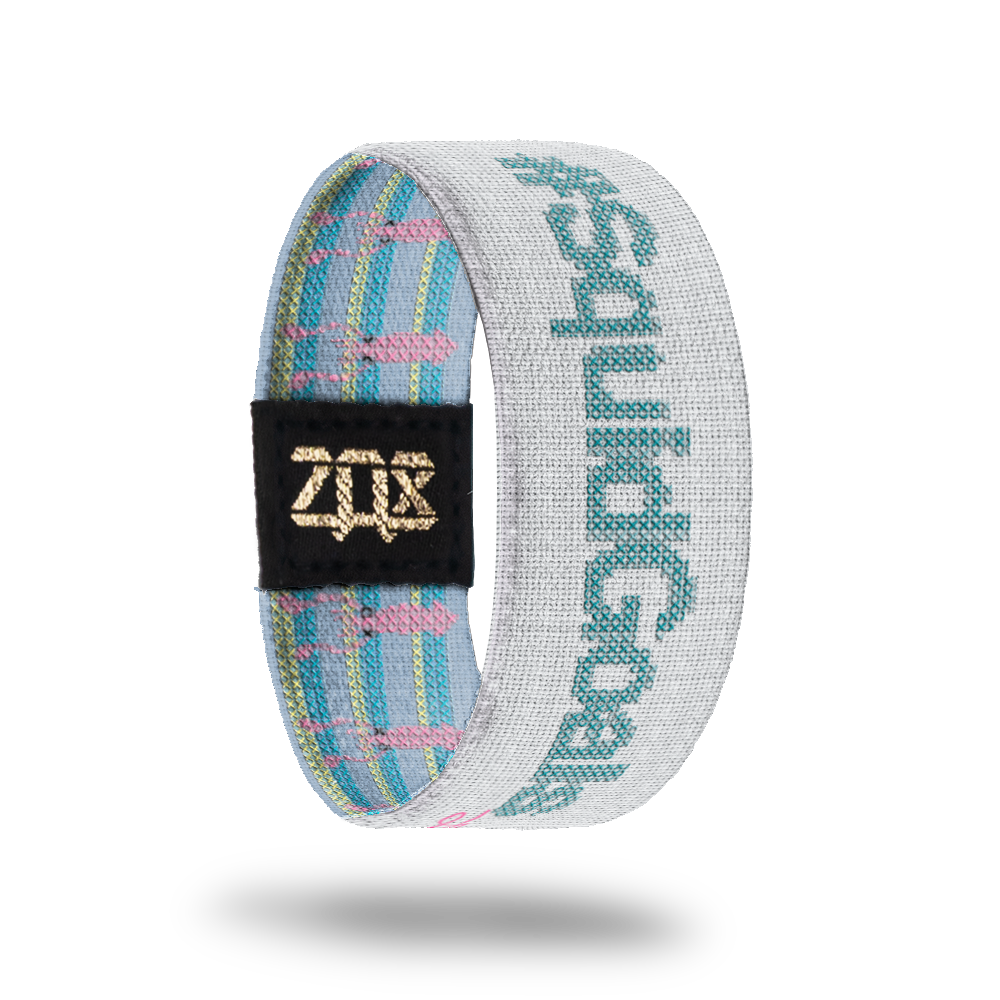 Product photo of the inside of SquidGoals: light gray design with teal '#SquidGoals' text