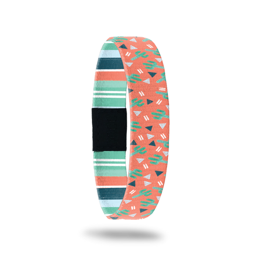 Outside design for Stay Positive. Orange background with green illustrated cactus and a few dark blue and grey triangle spread along the design