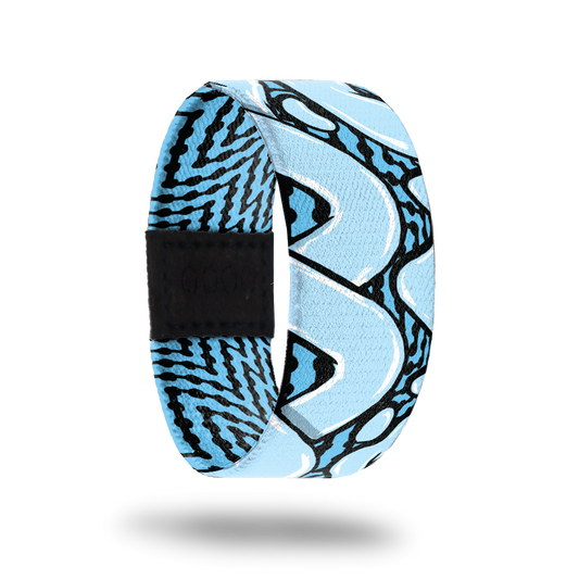 Outside design for You and Me. Blue background with black zig-zag lines and large light blue loop lines over the background