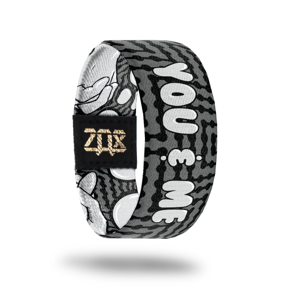 Inside design for You and Me. Dark grey background with black zig-zag lines. Centered is You & Me in light grey text 