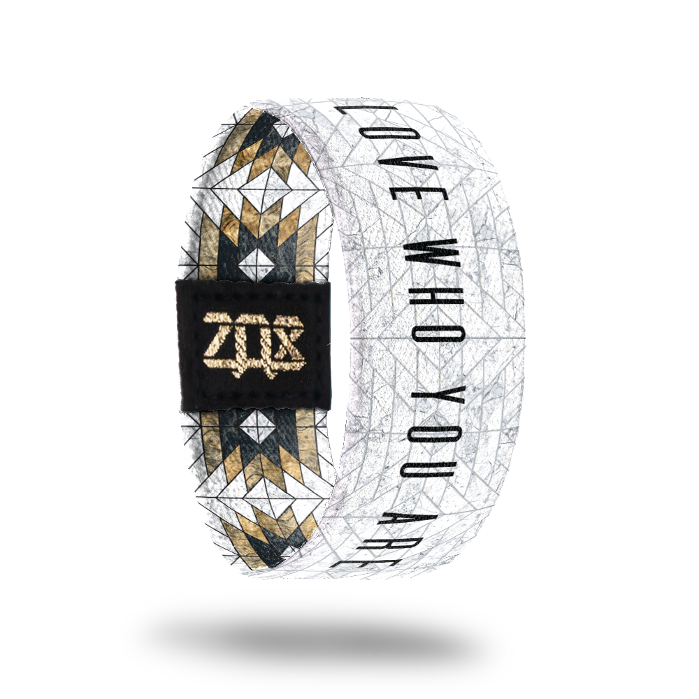 Inside design of Love Who You Are. White background with thin faded gray pattern lines. Love Who You Are centered and in black font
