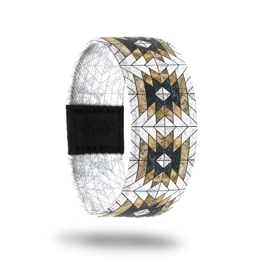 Outside design of Love Who You Are. Geometric repeating pattern with the colors white, yellow-gold, and black.