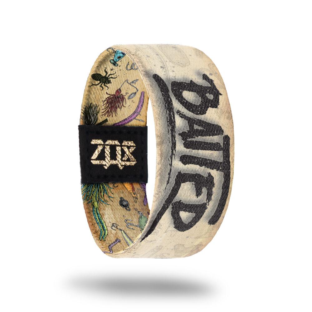 Inside design of Baited with a tan background and Baited in a faded black text